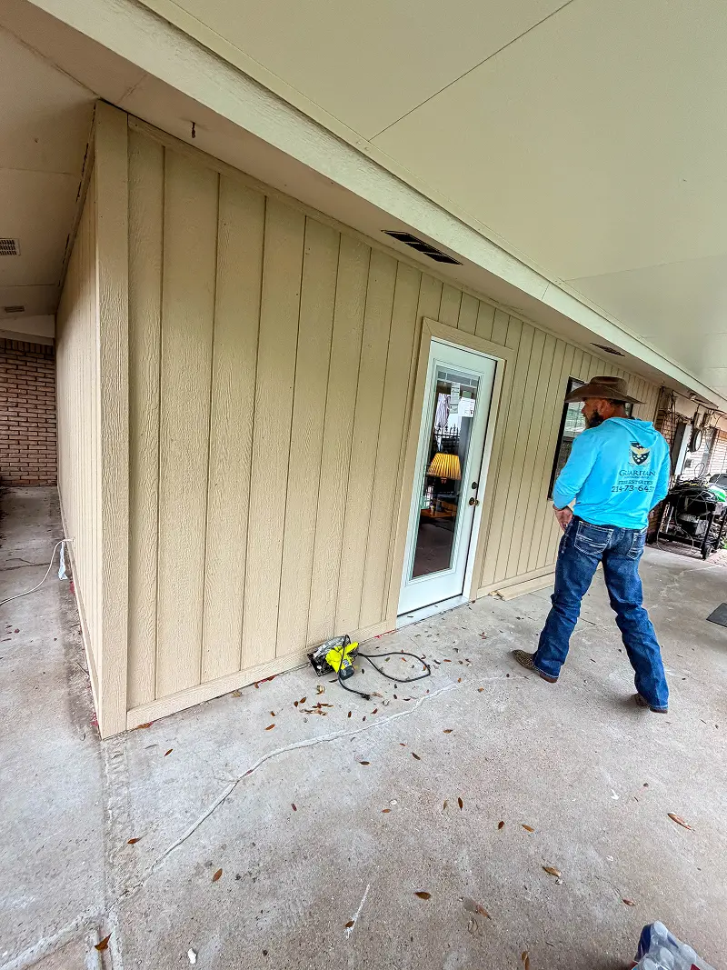 Restoration professional discussing moisture prevention with homeowners.