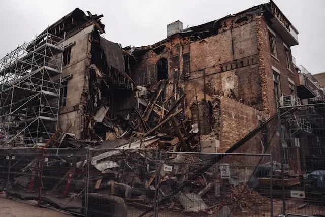 Structurally damaged building illustrating the need to secure a property after a fire.