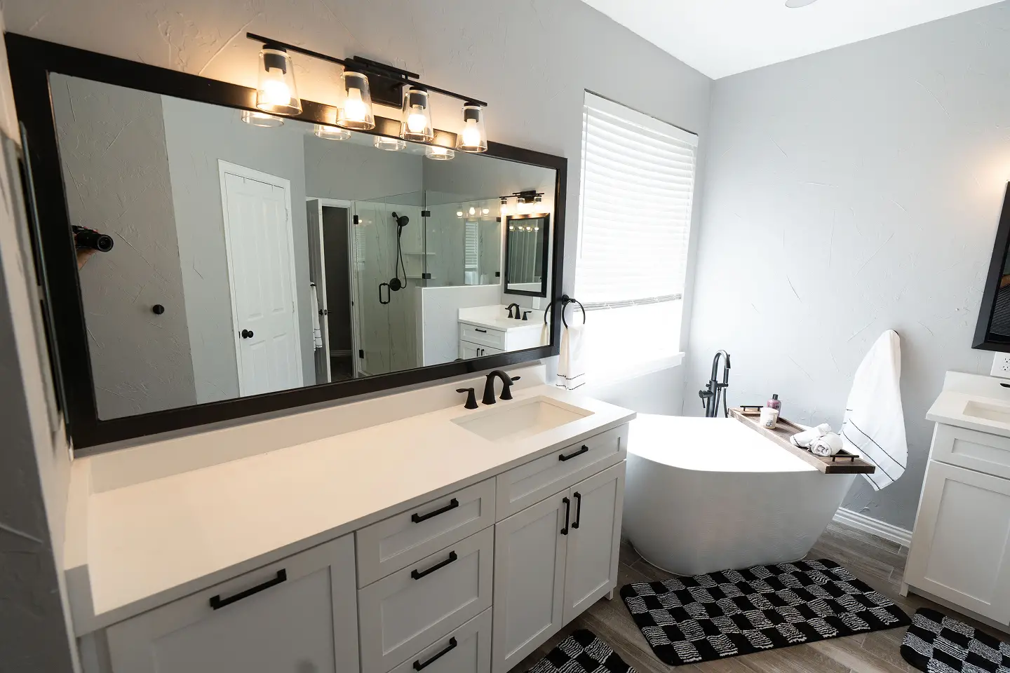 Modern bathroom with a glass shower, tiled walls, and updated fixtures